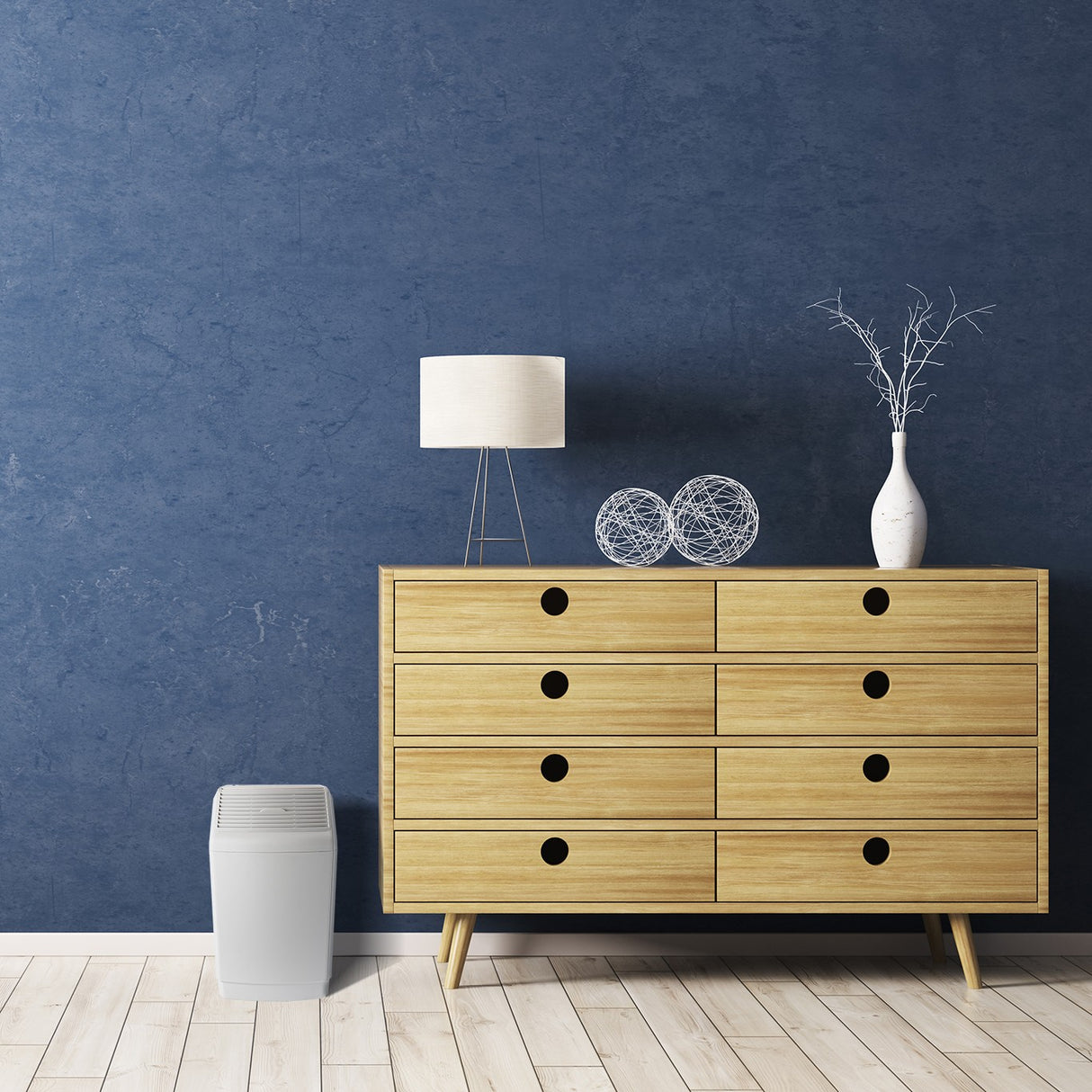 AIRCARE Space Saver 6-Gallon Evaporative Whole House Digital Humidifier - in bedroom with dark blue walls