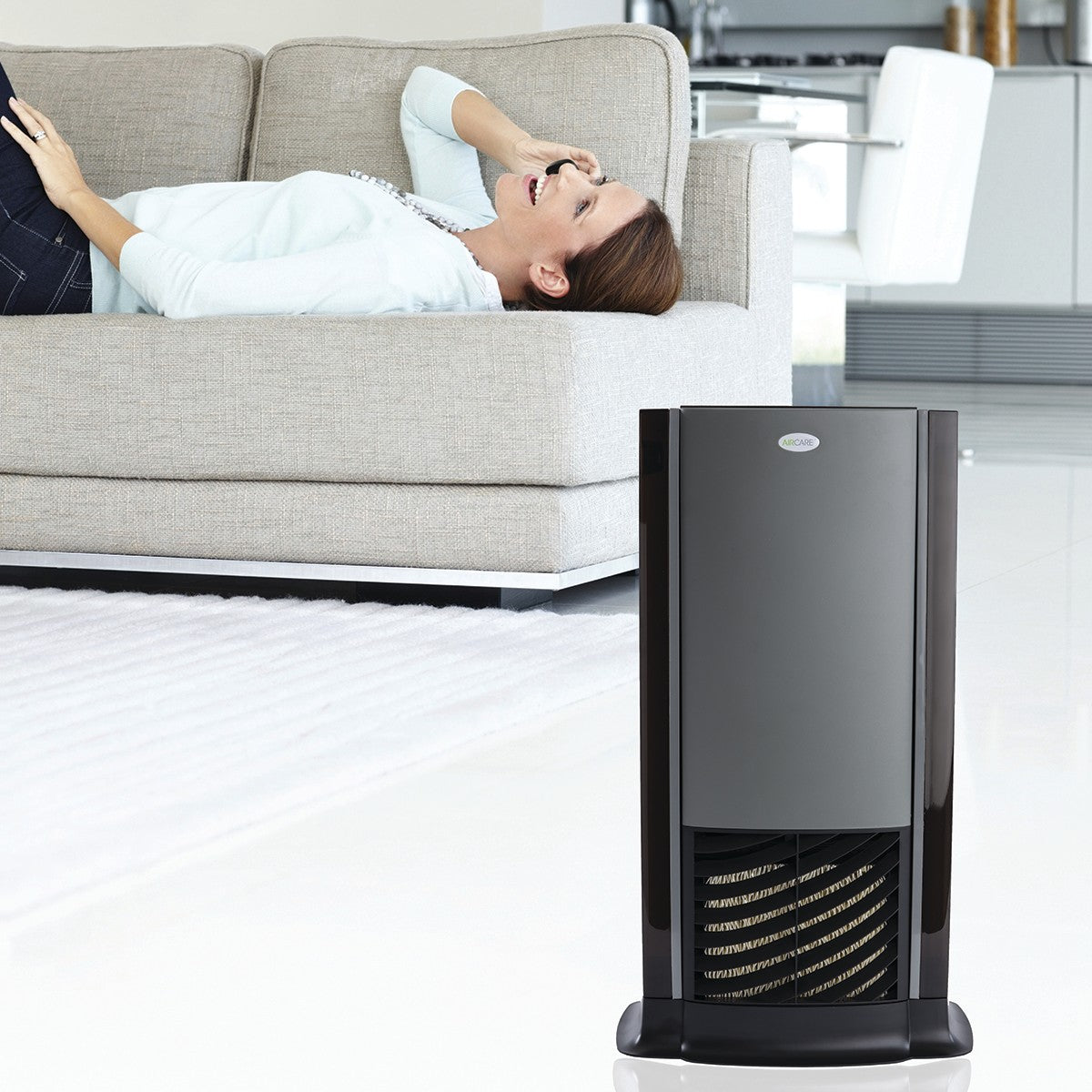 AIRCARE Tower Multi-Room Evaporative Humidifier - close up on living room floor