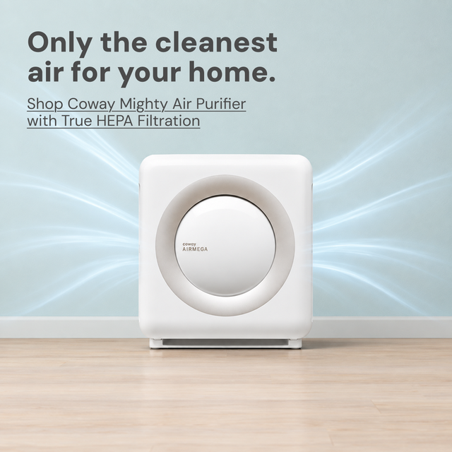 Only the cleanest air for your home sanctuary. A Coway air purifier in family room with dad in the kitchen making a bottle.