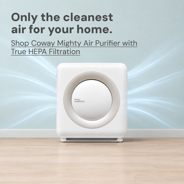 Only the cleanest air for your home sanctuary. A Coway air purifier in family room with dad in the kitchen making a bottle.