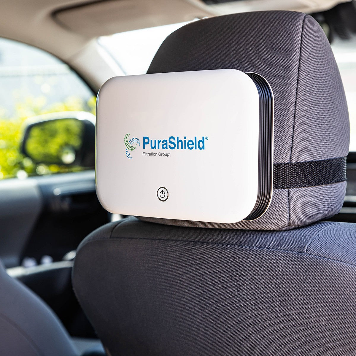 Purafil Purashield Mini Air Scrubber - Attached to car headrest.