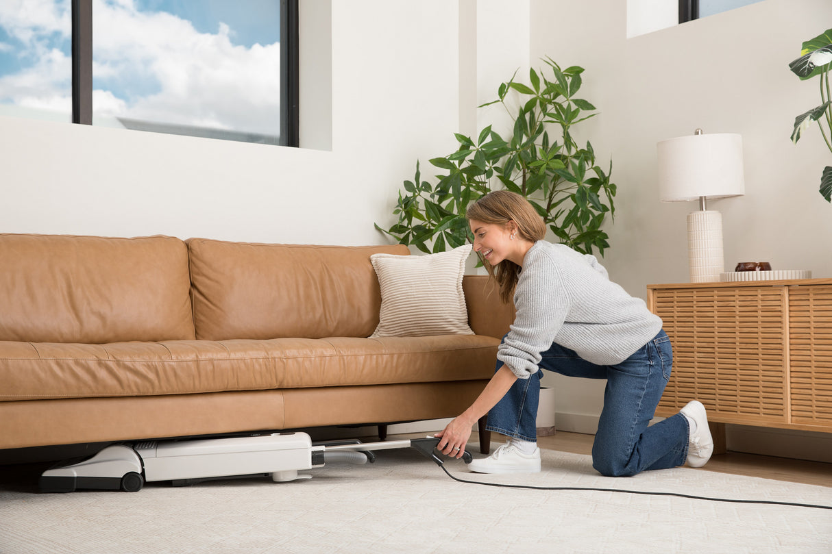 SEBO Automatic X7 Premium Upright folds flat to clean beneath the couch