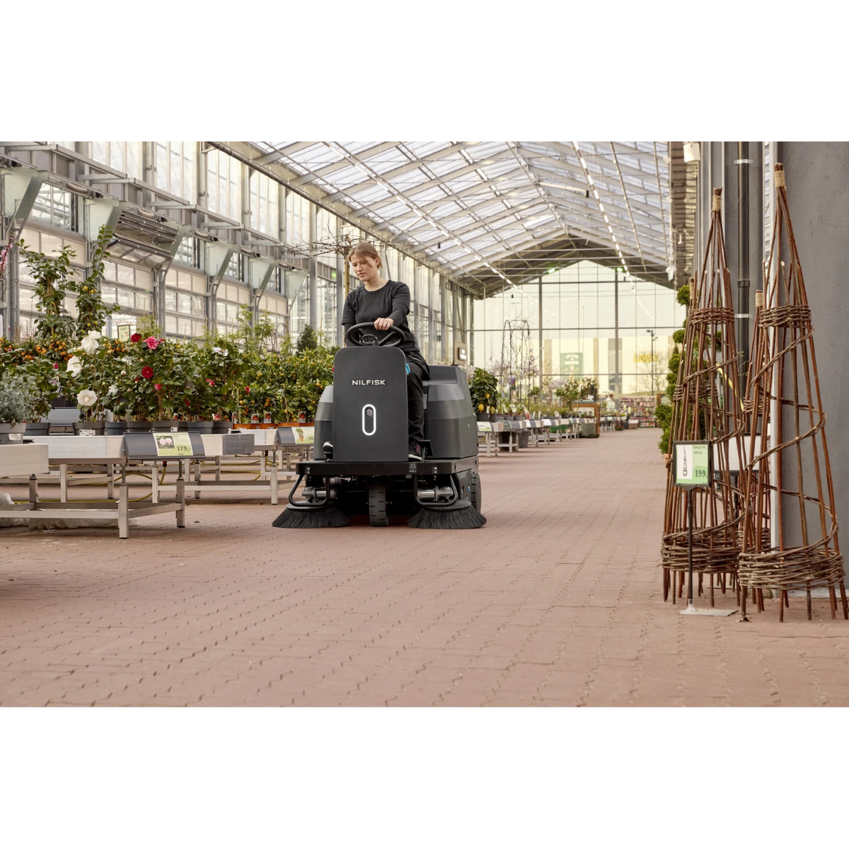 Nilfisk SW3000 Battery-Operated Ride-On Sweeper - Lifestyle 1