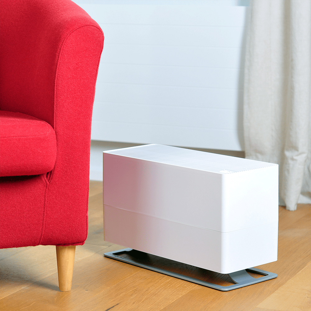 Stadler Form Oskar Big Humidifier - White - on the floor against bright red couch