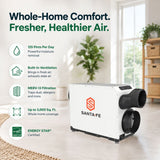 Santa Fe Ultra V125 Ventilating Dehumidifier shown in a bright modern room with informational callouts on the left for 125 pts moisture removal a day, built in ventilation, merv-13 filtration, up to 3000 sq ft and energy star certified.